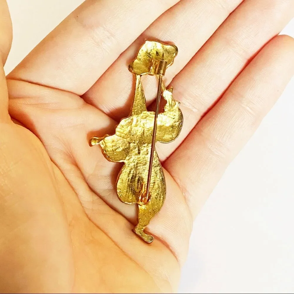 Vintage gold enamel rhinestone clown brooch
